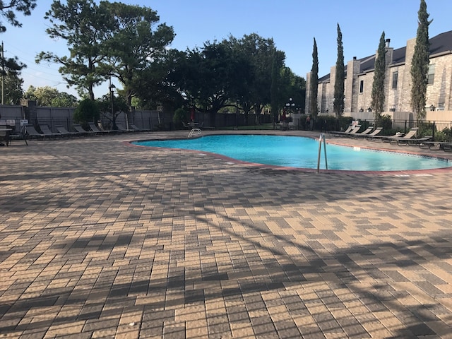 view of pool featuring a patio