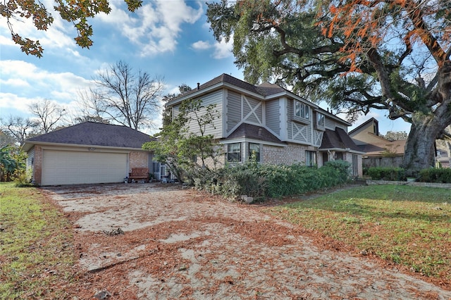 view of front facade with a garage and a front yard