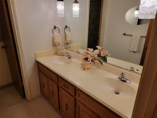 bathroom featuring tile flooring and double sink vanity