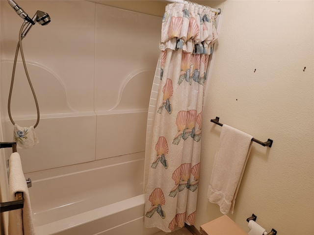 bathroom featuring shower / bathtub combination with curtain