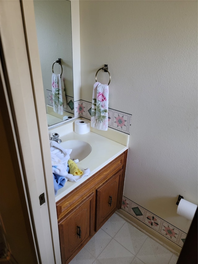 bathroom featuring tile floors and vanity