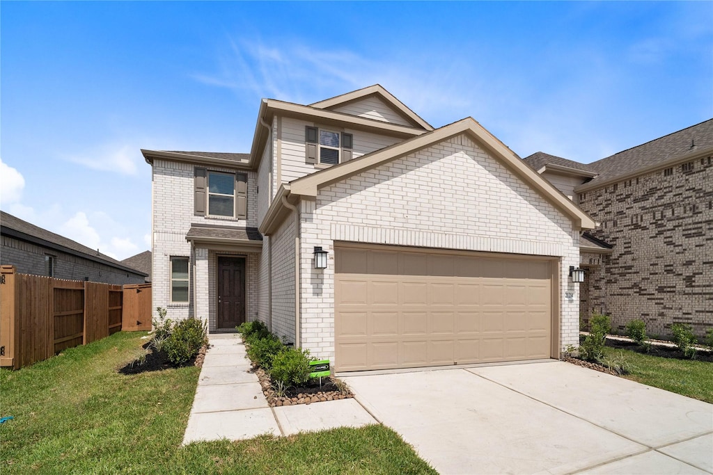 21214 Montego Bay Dr, Cypress, TX 77433 - view of front of property with a garage, driveway, and brick siding