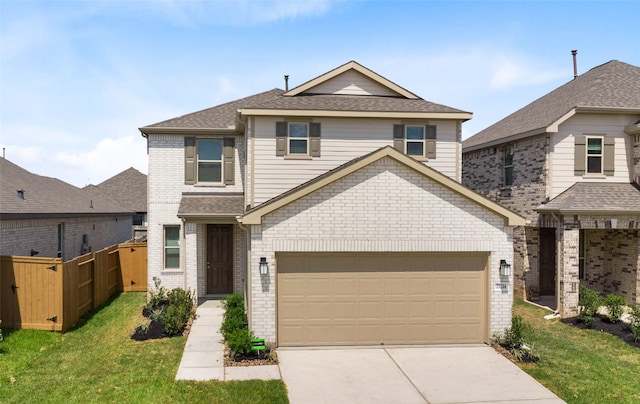 front facade featuring a garage and a front lawn