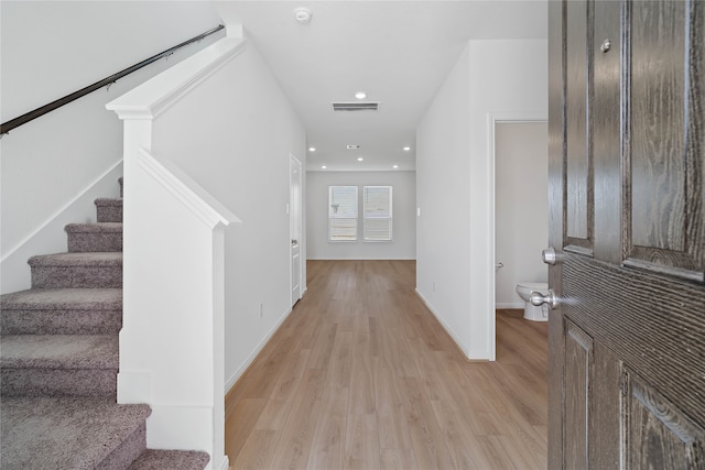 foyer entrance with light hardwood / wood-style flooring