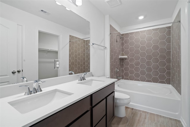 21214 Montego Bay Dr, Cypress, TX 77433 - bathroom featuring bathtub / shower combination, toilet, and double vanity