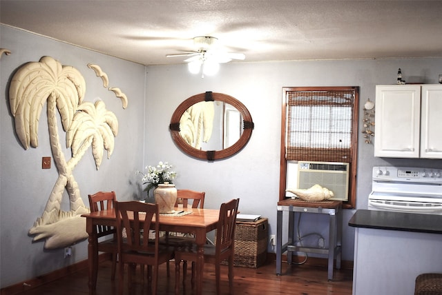 dining area featuring a textured ceiling, dark hardwood / wood-style floors, and ceiling fan