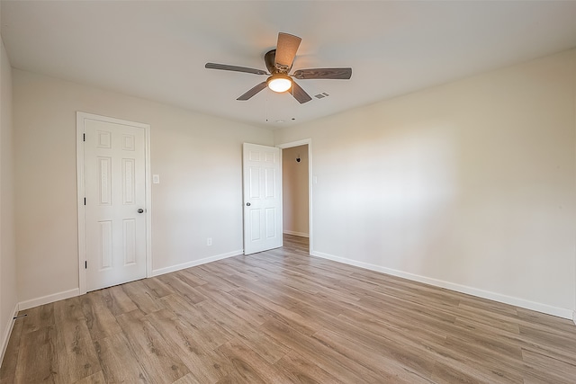 unfurnished room with ceiling fan and light hardwood / wood-style flooring