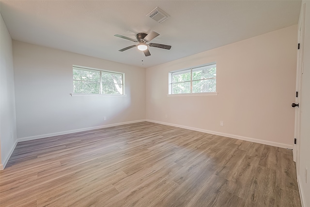 unfurnished room with ceiling fan and light wood-type flooring