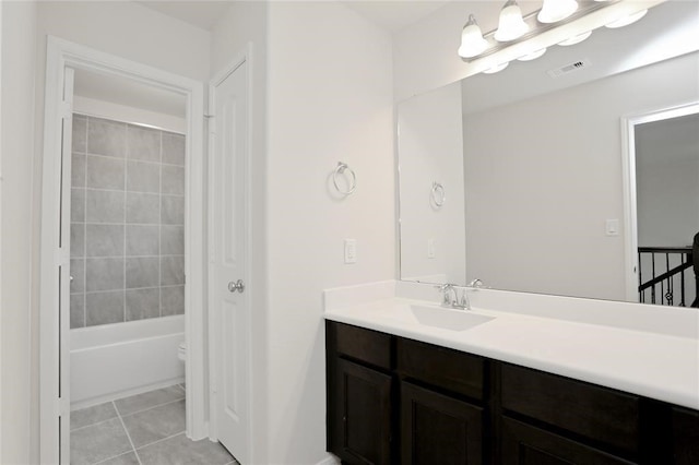 full bathroom featuring washtub / shower combination, tile flooring, vanity, and toilet