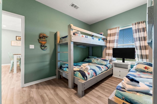 bedroom with light hardwood / wood-style floors