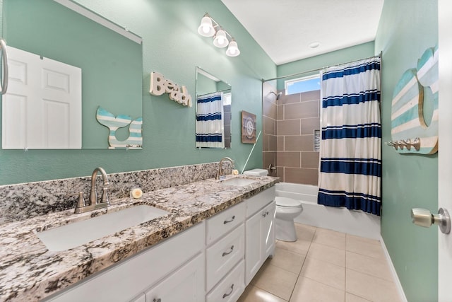 full bathroom featuring shower / bath combo with shower curtain, toilet, tile patterned floors, and vanity