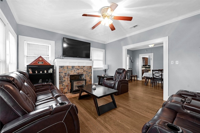 living room with ceiling fan, ornamental molding, hardwood / wood-style floors, and a wealth of natural light