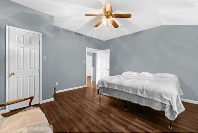 bedroom with dark hardwood / wood-style flooring, lofted ceiling, and ceiling fan