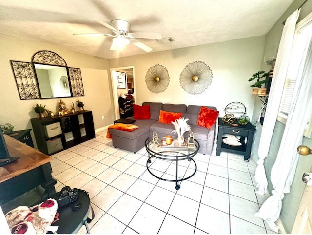 living room with tile patterned floors and ceiling fan