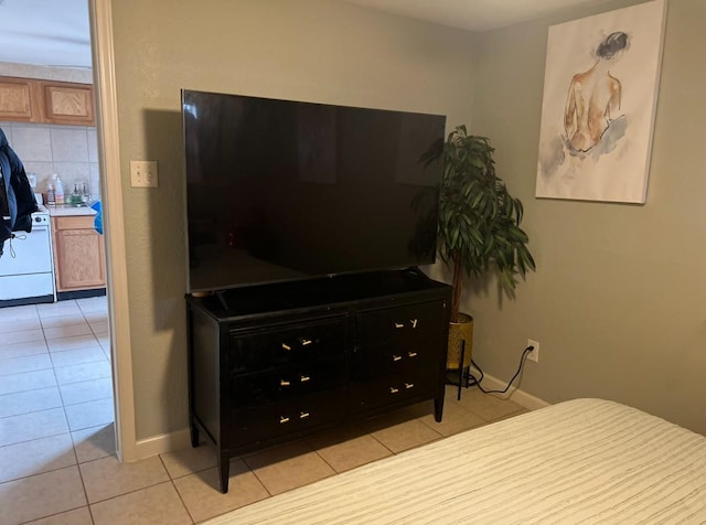 bedroom with light tile patterned floors