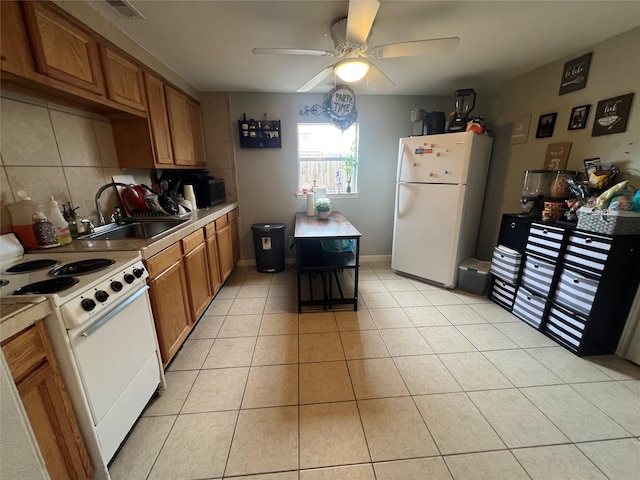 kitchen featuring sink, white appliances, ceiling fan, light tile patterned flooring, and decorative backsplash