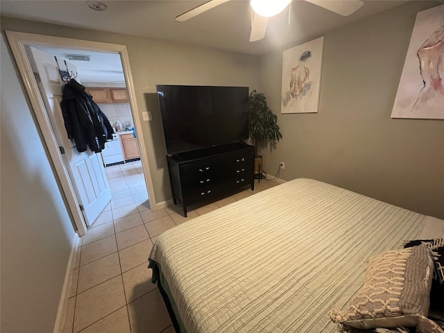 bedroom featuring light tile patterned floors and ceiling fan