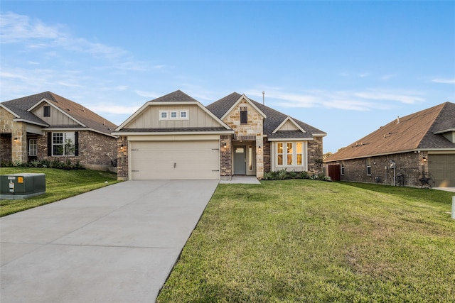 craftsman inspired home featuring a garage and a front lawn