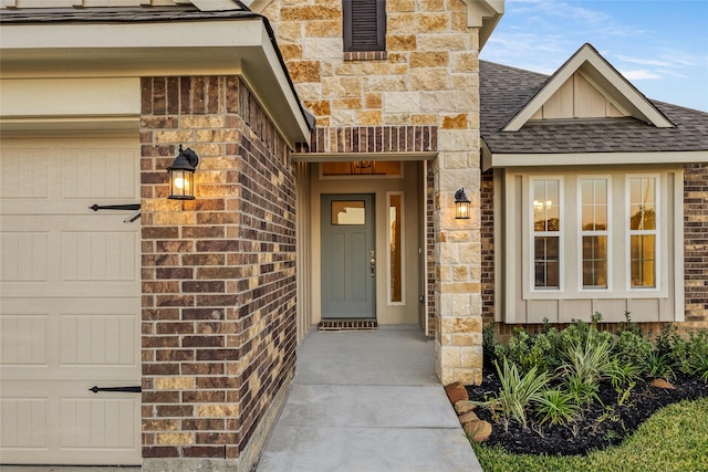 view of exterior entry featuring a garage