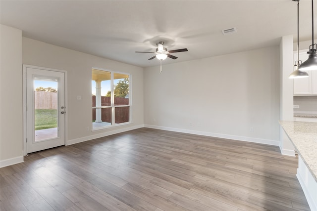 interior space with ceiling fan and light wood-type flooring