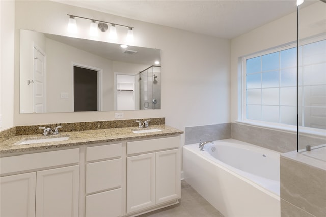 bathroom with vanity, plus walk in shower, and tile patterned floors