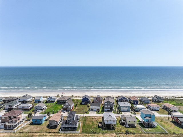 drone / aerial view featuring a view of the beach and a water view