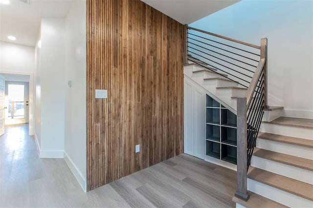 staircase featuring hardwood / wood-style floors