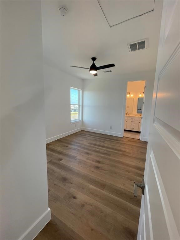 spare room featuring hardwood / wood-style floors and ceiling fan