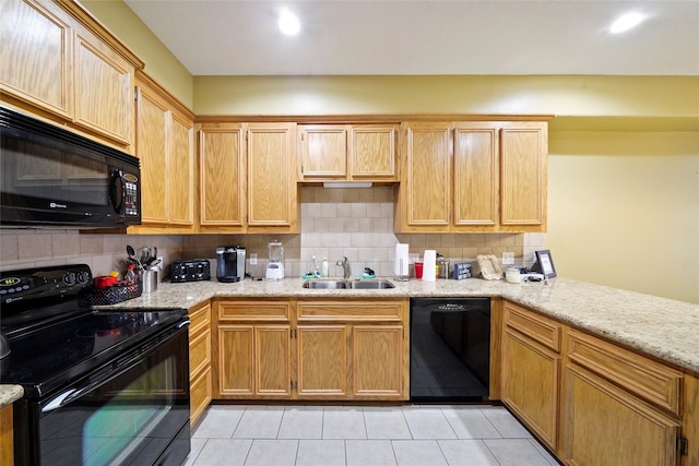 kitchen featuring sink, tasteful backsplash, black appliances, and light tile floors