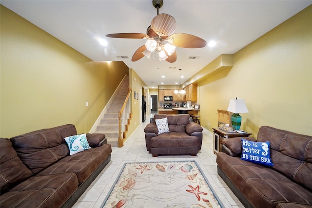 living room featuring ceiling fan and light tile floors