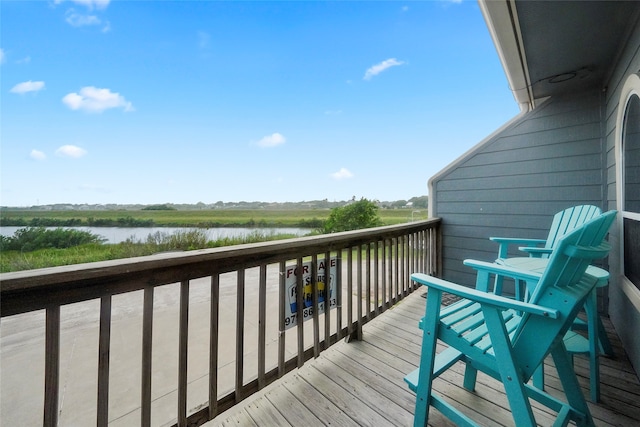 wooden terrace with a water view