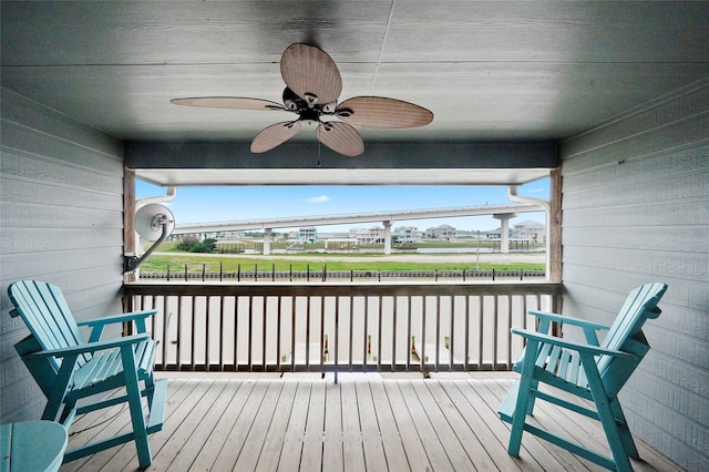 wooden deck with ceiling fan