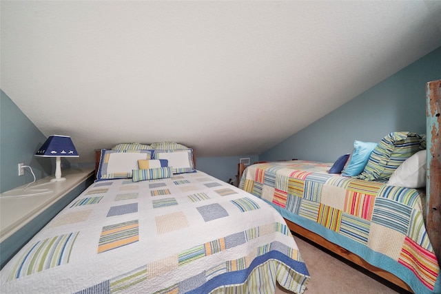 bedroom with vaulted ceiling and carpet