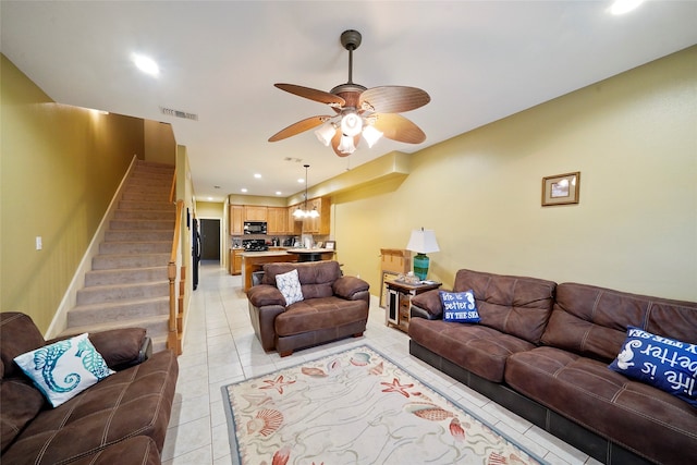 living room with ceiling fan and light tile floors