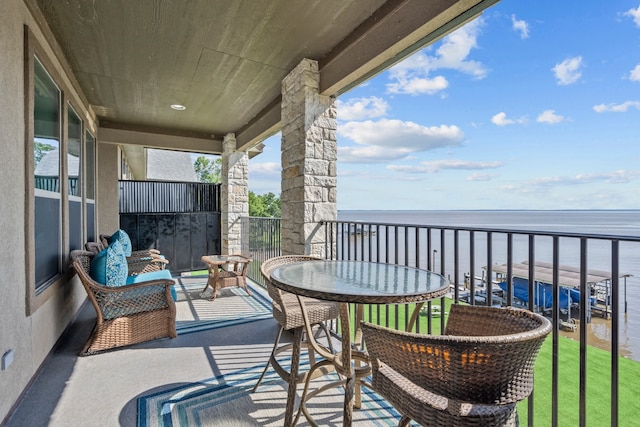 balcony featuring a water view