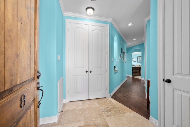 interior space with crown molding