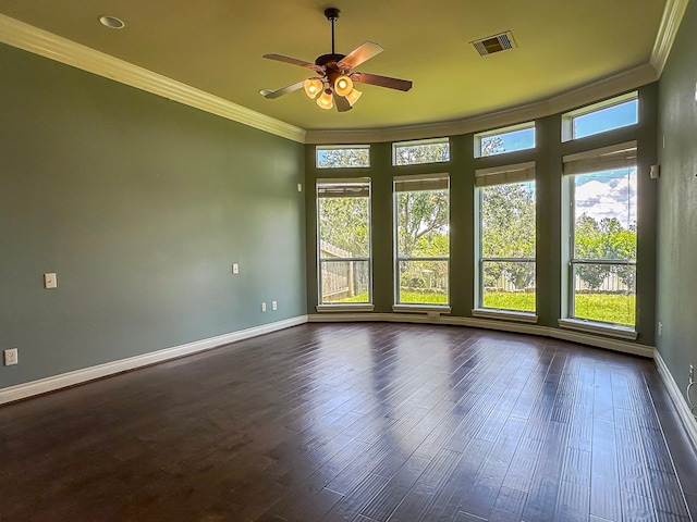 spare room with ceiling fan, dark hardwood / wood-style flooring, and crown molding