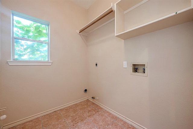 laundry room with hookup for a washing machine, hookup for a gas dryer, light tile patterned flooring, and electric dryer hookup