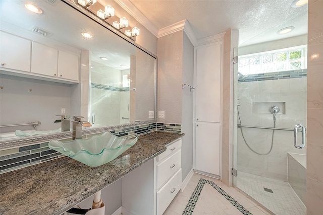 bathroom with ornamental molding, vanity, decorative backsplash, and a shower with shower door