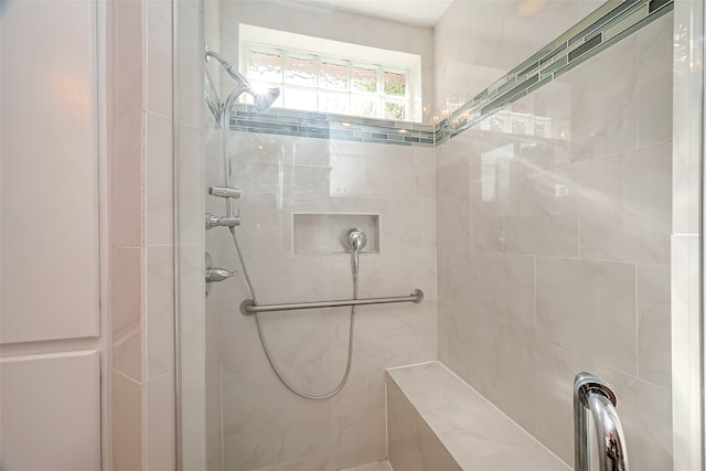 bathroom with tiled shower