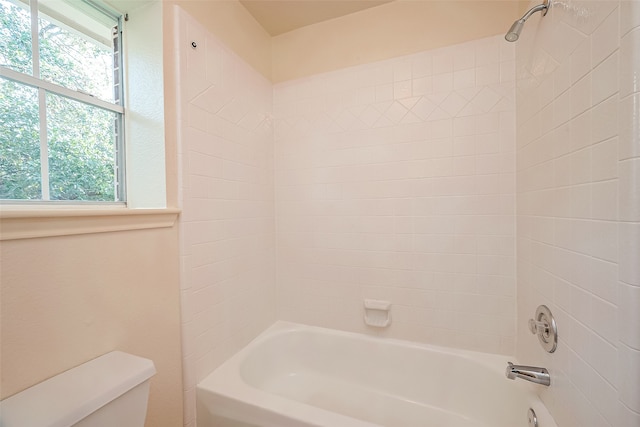 bathroom with shower / bathtub combination, a wealth of natural light, and toilet