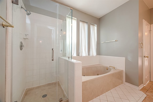 bathroom featuring shower with separate bathtub and tile patterned floors