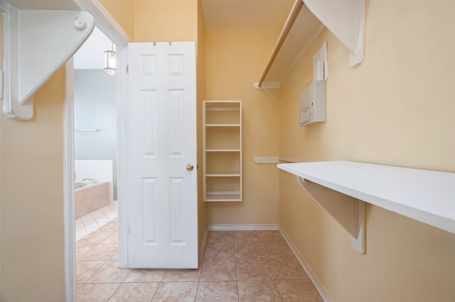 walk in closet featuring light tile patterned floors