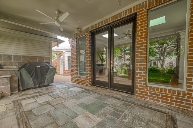 view of patio / terrace with ceiling fan, french doors, and grilling area