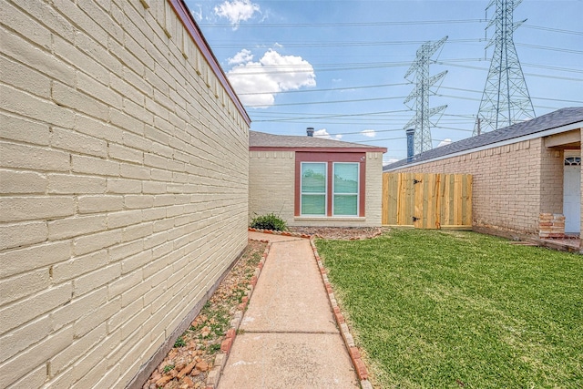 view of home's exterior with a yard