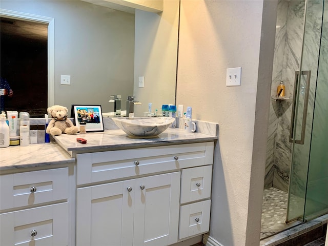 bathroom with an enclosed shower and vanity