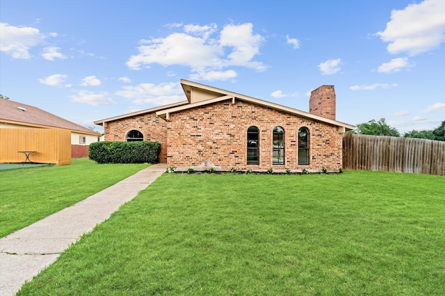 view of front of property with a front lawn