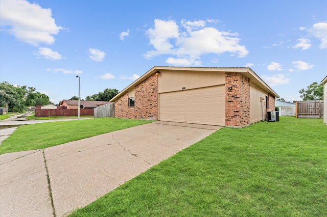 ranch-style house featuring a front yard and a garage