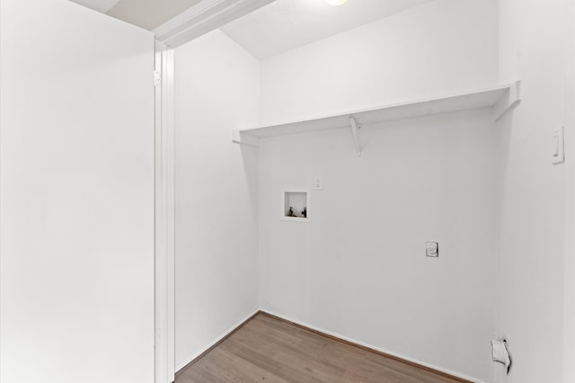 clothes washing area with wood-type flooring and washer hookup