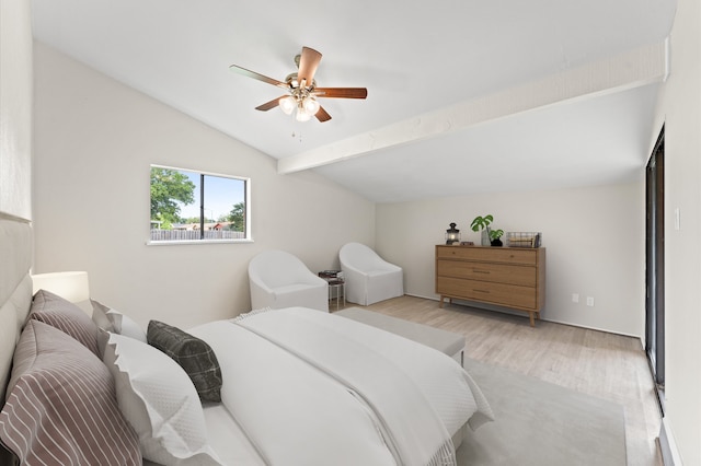 bedroom with lofted ceiling with beams, ceiling fan, and light hardwood / wood-style flooring